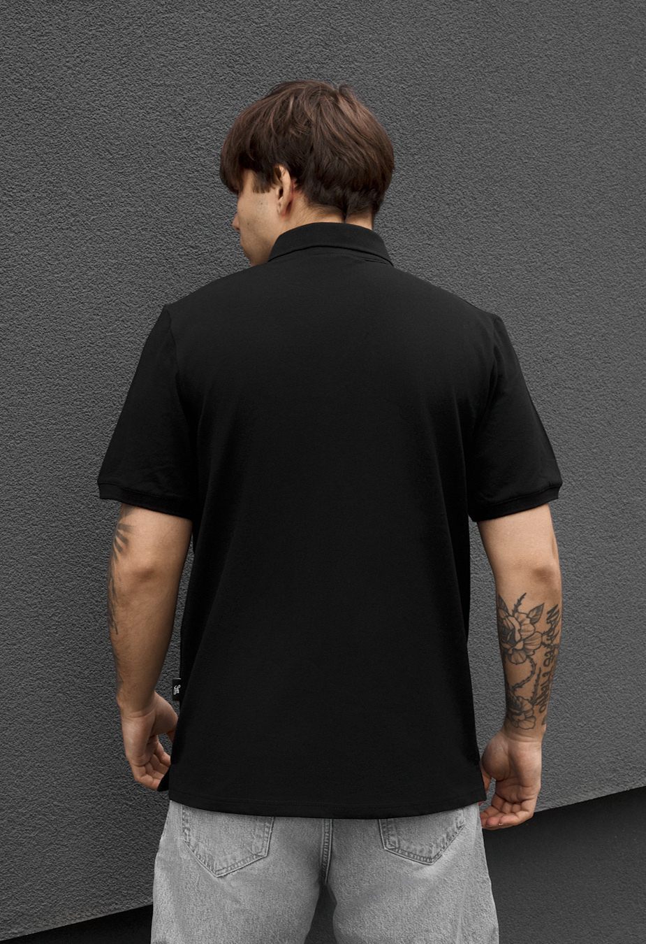 Polo Staff we logo black
