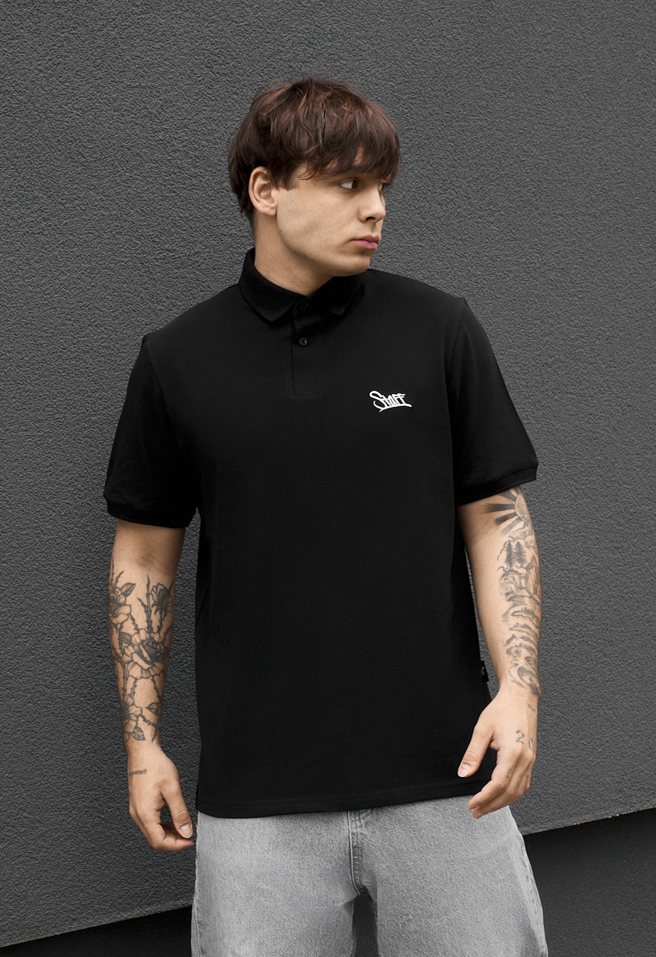 Polo Staff we logo black