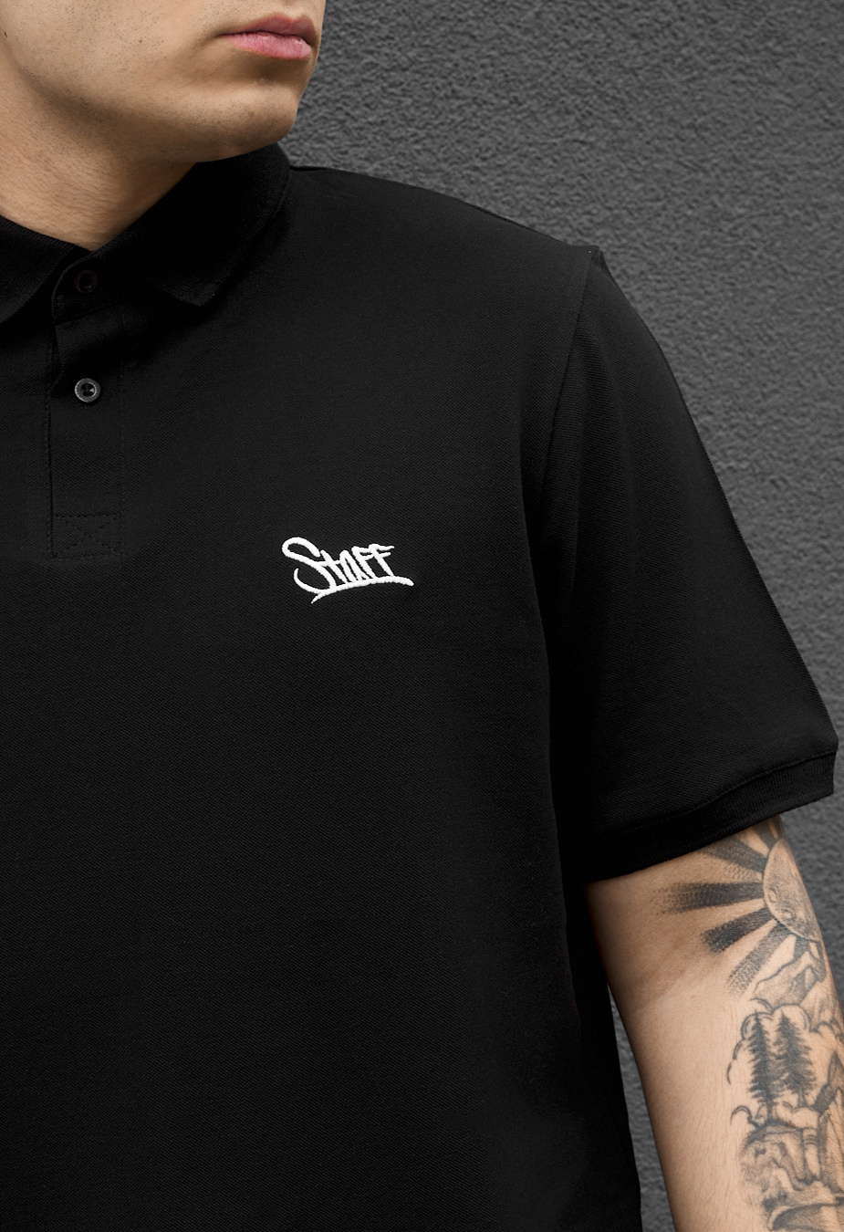 Polo Staff we logo black