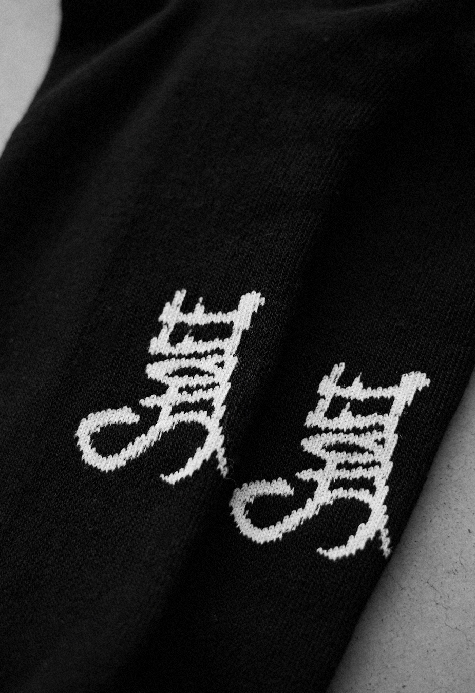 Skarpety Staff black logo